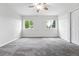 This spacious bedroom features carpet, two large windows and a built in closet at 2495 S Lansing Way, Aurora, CO 80014