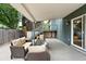 Inviting covered patio with comfortable seating, perfect for outdoor entertaining and relaxation near an external stairway at 2495 S Lansing Way, Aurora, CO 80014