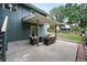 Cozy outdoor patio area featuring stylish seating, a table and a lush green lawn with privacy fence at 2495 S Lansing Way, Aurora, CO 80014