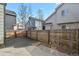 Private back yard with wooden fence, gravel, and concrete patio at 5428 W 115Th Dr, Westminster, CO 80020