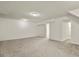 Finished basement with neutral carpet and access to other rooms at 5428 W 115Th Dr, Westminster, CO 80020