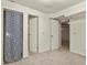 Spacious finished basement with carpeting, multiple doors, and a patterned curtain at 5428 W 115Th Dr, Westminster, CO 80020