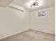 Bright, finished basement room with neutral carpeting and a modern light fixture at 5428 W 115Th Dr, Westminster, CO 80020