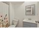 Charming bathroom with modern vanity, updated fixtures, and a floral shower curtain at 5428 W 115Th Dr, Westminster, CO 80020