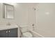 Bathroom with a tub and shower combination, white tile, and a vessel sink at 5428 W 115Th Dr, Westminster, CO 80020