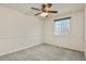 Carpeted bedroom with a ceiling fan and natural light from a window at 5428 W 115Th Dr, Westminster, CO 80020