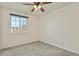 Carpeted bedroom with a ceiling fan and natural light from a window at 5428 W 115Th Dr, Westminster, CO 80020