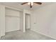 Carpeted bedroom with a closet for storage and a ceiling fan at 5428 W 115Th Dr, Westminster, CO 80020