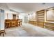 Spacious basement featuring a bar area and built-in shelving units at 3631 E Virginia Ave, Denver, CO 80209