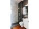 Modern bathroom with walk-in shower, sleek fixtures, and a stylish vanity at 9 Sedgwick Dr, Englewood, CO 80113