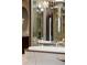 Modern bathroom features a sleek white soaking tub and unique mirrored wall at 9 Sedgwick Dr, Englewood, CO 80113