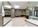 The spa-like bathroom features a modern soaking tub, custom mirrors, and vanity with sink at 9 Sedgwick Dr, Englewood, CO 80113
