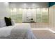 Modern bedroom with display shelves and carpeted floors at 9 Sedgwick Dr, Englewood, CO 80113