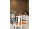 Elegant dining room featuring modern chairs with orange accents and ample seating for Gathering and guests at 9 Sedgwick Dr, Englewood, CO 80113