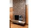 Striking fireplace featuring a unique tile surround and marble hearth, creating a cozy and elegant focal point at 9 Sedgwick Dr, Englewood, CO 80113