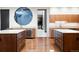 Modern kitchen featuring stainless steel appliances, custom cabinetry, and ample counter space, great for culinary enthusiasts at 9 Sedgwick Dr, Englewood, CO 80113