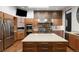 Beautiful kitchen with a large island, stainless steel appliances, and custom cabinetry, perfect for cooking and entertaining at 9 Sedgwick Dr, Englewood, CO 80113