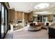 A large and uniquely decorated living room features a fireplace and ample seating at 9 Sedgwick Dr, Englewood, CO 80113