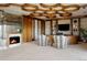 Stunning living room features a modern fireplace, unique ceiling design, and comfortable seating at 9 Sedgwick Dr, Englewood, CO 80113