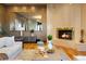 Inviting living room with a fireplace, large mirror, and contemporary decor at 9 Sedgwick Dr, Englewood, CO 80113