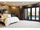 Spacious main bedroom features plush carpet, private outdoor access, and modern finishes at 9 Sedgwick Dr, Englewood, CO 80113