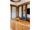 Elegant office features custom shelving, a unique desk, and refined finishes at 9 Sedgwick Dr, Englewood, CO 80113