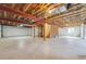 Unfinished basement with exposed beams, white walls, and concrete flooring at 5605 Killen Ave, Castle Rock, CO 80104