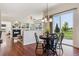 Dining area with table set for four, views of backyard and access to living room at 5605 Killen Ave, Castle Rock, CO 80104