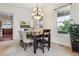 Dining room featuring carpet, chandelier lighting and backyard views at 5605 Killen Ave, Castle Rock, CO 80104