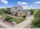 Beautiful two-story home with a three-car garage and lush landscaped front yard at 5605 Killen Ave, Castle Rock, CO 80104