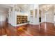 Bright foyer with hardwood floors, open staircase and display shelving at 5605 Killen Ave, Castle Rock, CO 80104
