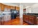 Gourmet kitchen with stainless steel appliances, wooden cabinets, and ample counter space at 5605 Killen Ave, Castle Rock, CO 80104