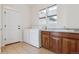 Convenient laundry room featuring washer, dryer, sink, and ample cabinet space at 5605 Killen Ave, Castle Rock, CO 80104