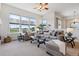 Bright living room featuring large windows with nice views, comfortable seating, and neutral decor at 5605 Killen Ave, Castle Rock, CO 80104
