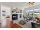 Living room featuring a fireplace, large windows, and comfortable seating arrangements at 5605 Killen Ave, Castle Rock, CO 80104