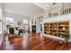 Bright living room with hardwood floors, fireplace, and built-in shelving at 5605 Killen Ave, Castle Rock, CO 80104
