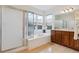 Well-appointed main bathroom with dual vanities, large tub, and glass-enclosed shower at 5605 Killen Ave, Castle Rock, CO 80104