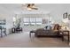 Spacious main bedroom with ceiling fan, large windows providing abundant natural light, and neutral decor for a calming ambiance at 5605 Killen Ave, Castle Rock, CO 80104