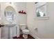 Charming powder room featuring pedestal sink and decorative accents at 5605 Killen Ave, Castle Rock, CO 80104