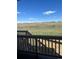 Great view overlooking grassy, undeveloped land from the back deck at 6739 Juniper Dr, Thornton, CO 80602