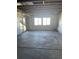 Unfinished basement with windows and walkout access, offering future expansion potential at 6739 Juniper Dr, Thornton, CO 80602
