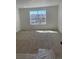 Carpeted bedroom featuring a large window offering natural light at 6739 Juniper Dr, Thornton, CO 80602