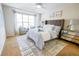 Stylishly furnished main bedroom featuring a ceiling fan and comfortable seating area at 451 S Reed St, Lakewood, CO 80226
