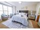 Stylishly furnished main bedroom featuring a ceiling fan and comfortable seating area at 451 S Reed St, Lakewood, CO 80226