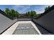 Private rooftop patio with tile flooring, lush greenery, and expansive views at 451 S Reed St, Lakewood, CO 80226