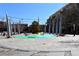 A town center with a colorful plaza featuring outdoor seating and public art installations, near shops and restaurants at 451 S Reed St, Lakewood, CO 80226