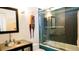 Modern bathroom featuring a vanity, artistic mirror, and a tiled shower-tub combination at 421 Dexter St, Denver, CO 80220