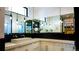 Modern bathroom featuring marble countertops, sleek fixtures, and contemporary lighting at 421 Dexter St, Denver, CO 80220