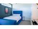 Stylish bedroom with tufted headboard, desk area, and modern decor at 421 Dexter St, Denver, CO 80220