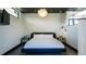 Modern bedroom with decorative wall panels, contemporary lighting, and stylish furnishings at 421 Dexter St, Denver, CO 80220